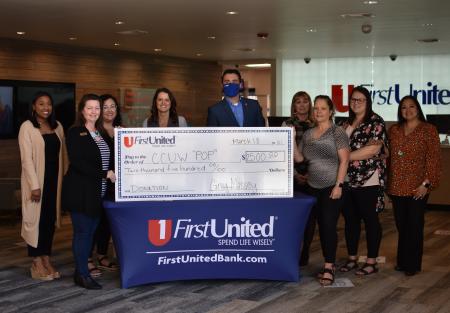 First United presents sponsorship check for Power of the Purse fundraiser